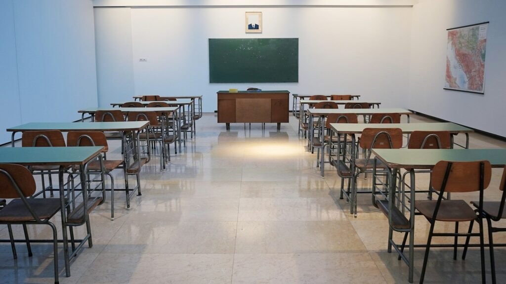 AI Professors - Empty classroom - Photo by Ivan Aleksic on Unsplash